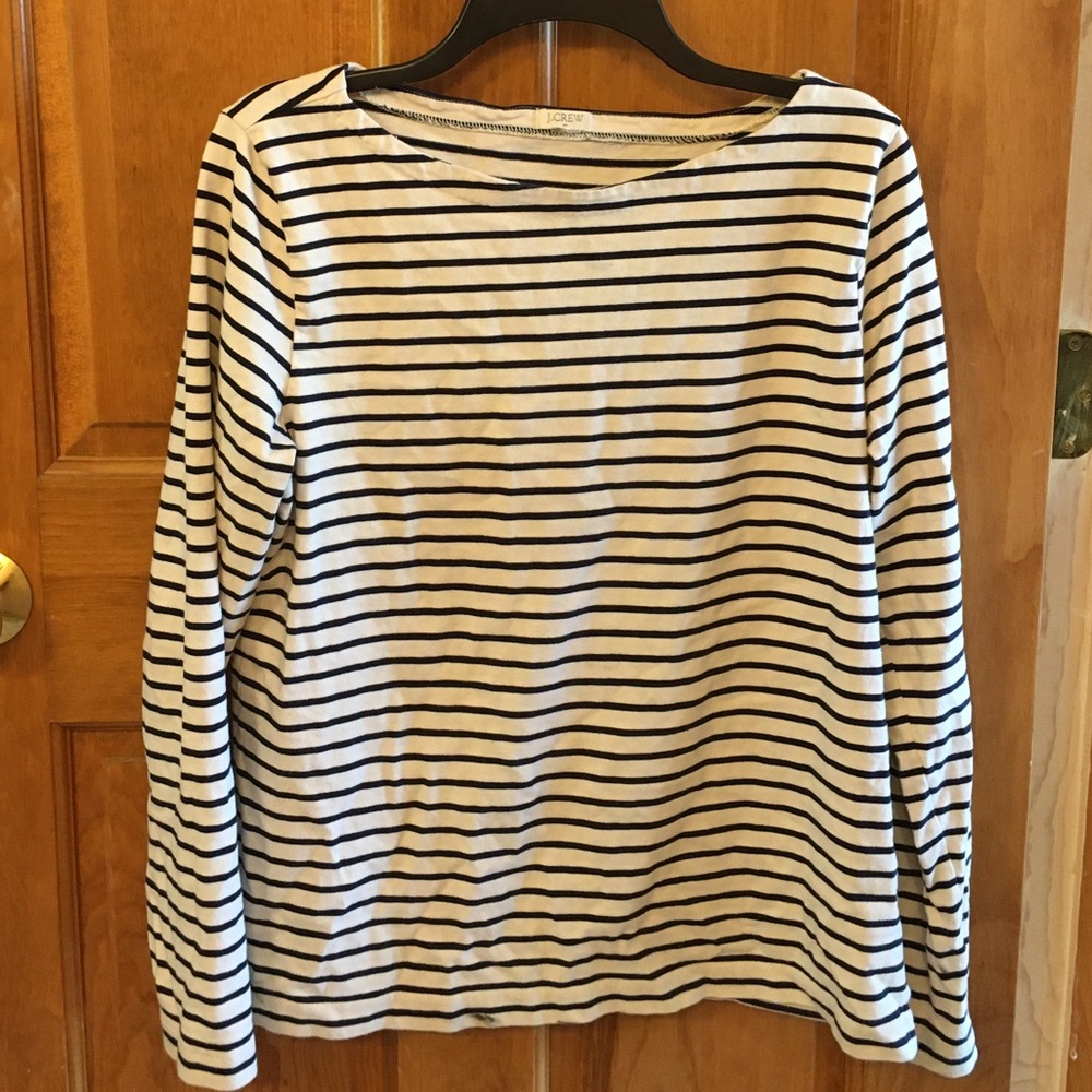 Long sleeve, navy blue and cream striped shirt.